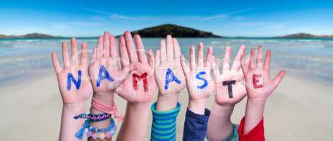 Children Hands Building Word Namaste Means Hello, Ocean Background