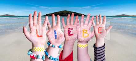 Children Hands Building Word Liebe Means Love, Ocean Background