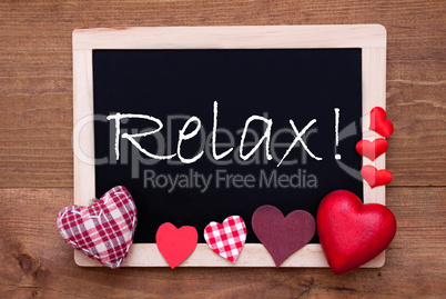 Balckboard With Red Heart Decoration, Text Relax, Wooden Background
