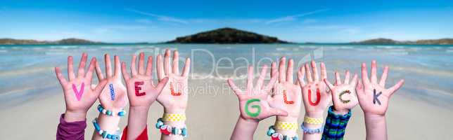 Kids Hands Holding Word Viel Glueck Means Good Luck, Ocean Background