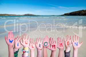 Children Hands Building Word Willkommen Means Welcome, Ocean Background