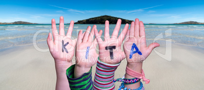 Children Hands Building Word KITA Means Kindergarden, Ocean Background