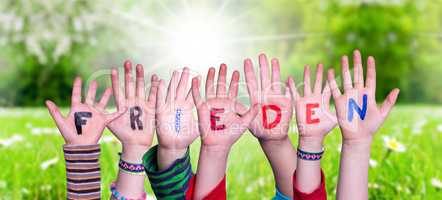 Children Hands Building Word Frieden Means Peace, Grass Meadow