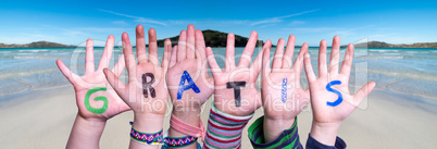 Children Hands Building Word Gratis Means Free, Ocean Background