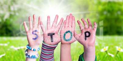 Children Hands Building Word Stop, Grass Meadow