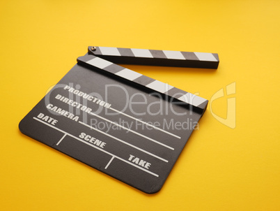 Clapboard on a yellow background