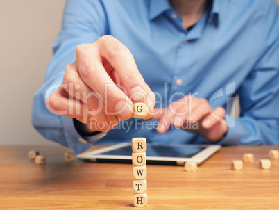 Concepual business image with small wooden blocks