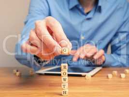 Concepual business image with small wooden blocks