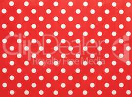 Paper texture with white dots on red using as background