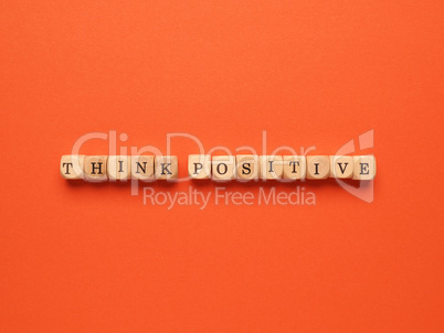 Think positive written with small wooden blocks