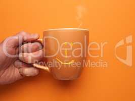 Orange coffee mug with a smiling icon