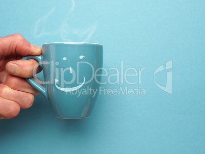 Blue coffee mug with a smiling icon