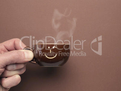 Brown espresso cup with a smiling icon