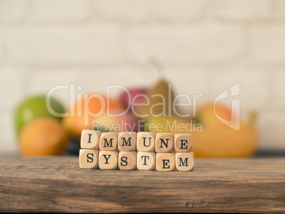 The words immune system on small wooden blocks, healthy eating c