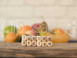 The words immune system on small wooden blocks, healthy eating c