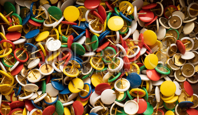 Full frame background image with lots of colorful thumbtacks