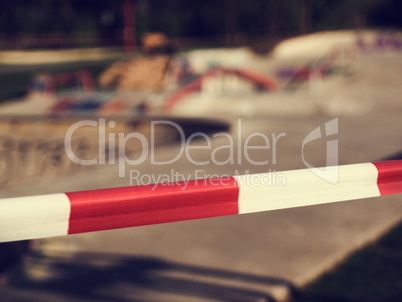 Close-up of the barrier tape in front of a skatepark, stay at ho