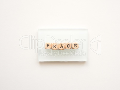 Wooden blocks with the word peace on a white background