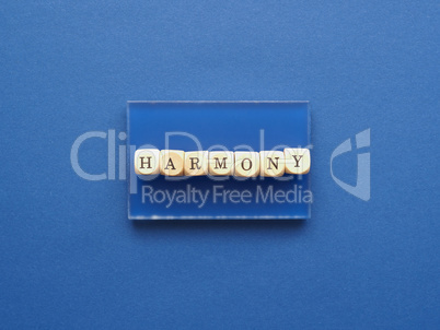 Wooden blocks with the word harmony on a blue background