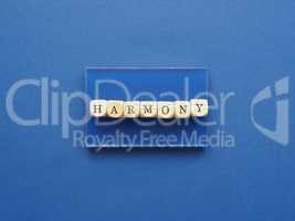 Wooden blocks with the word harmony on a blue background