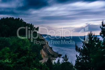 Cliff with birch woodland at twilight