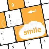 Computer keyboard with smile words on key - business concept