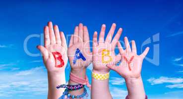 Children Hands Building Word Baby, Blue Sky