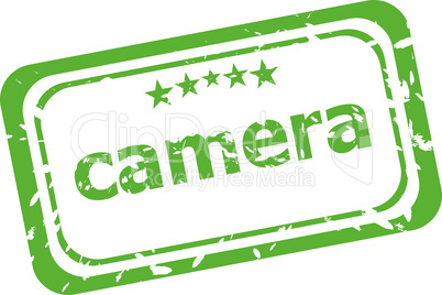 camera on rubber stamp over a white background