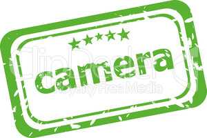 camera on rubber stamp over a white background