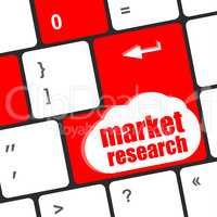 key with market research text on laptop keyboard, business concept