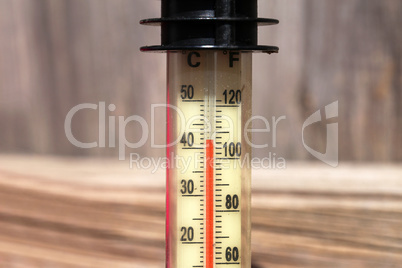 Thermometer displaying high 40 degree hot temperatures in summer day.