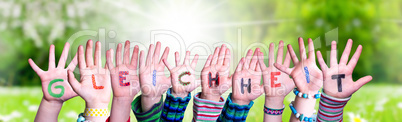Children Hands Building Word Gleichheit Means Equality, Grass Meadow