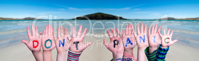 Kids Hands Holding Word Do Not Panic, Ocean Background