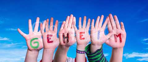 Children Hands Building Word Geheim Means Secret, Blue Sky