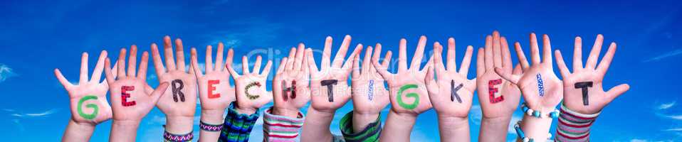 Children Hands Building Word Gerechtigkeit Means Justice, Blue Sky