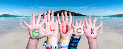 Children Hands Building Word Glueck Means Luck, Ocean Background