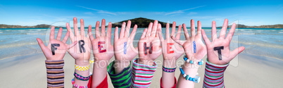 Children Hands Building Word Freiheit Means Freedom, Ocean Background