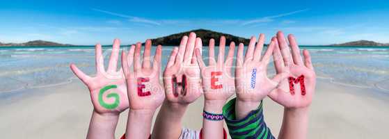 Children Hands Building Word Geheim Means Secret, Ocean Background