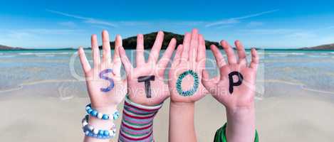 Children Hands Building Word Stop, Ocean Background