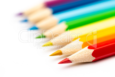 Colorful color wooden pencils on a white background