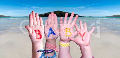 Children Hands Building Word Baby, Ocean Background