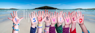 Children Hands Building Word I Survived, Ocean Background