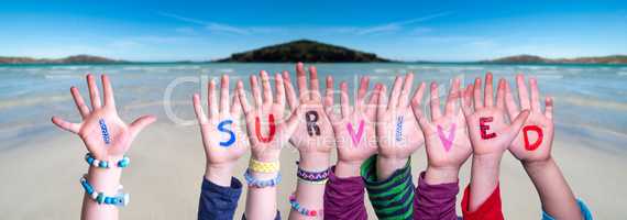 Children Hands Building Word I Survived, Ocean Background