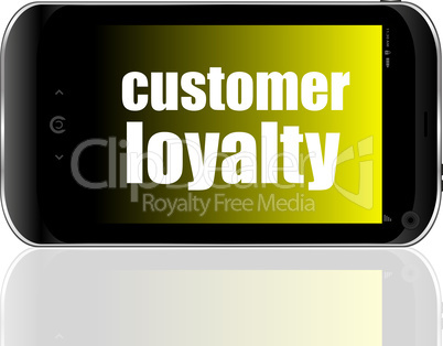 Advertising concept. Smartphone with text Customer Loyalty on display