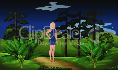 woman walking alone in the garden at night