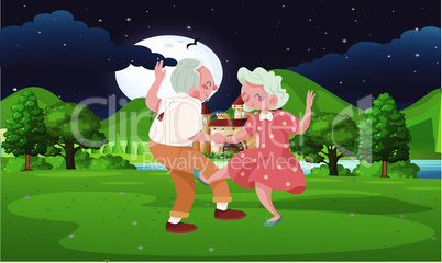 old couple dancing in the park at night