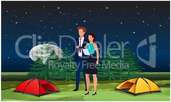 couple enjoying picnic in the forest night