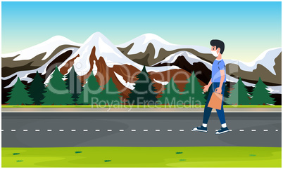 boy walking on the road near the mountains