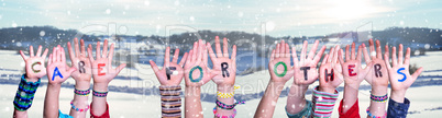 Children Hands Building Word Care For Others, Snowy Winter Background