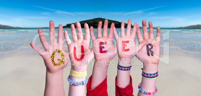 Children Hands Building Word Queer, Ocean Background